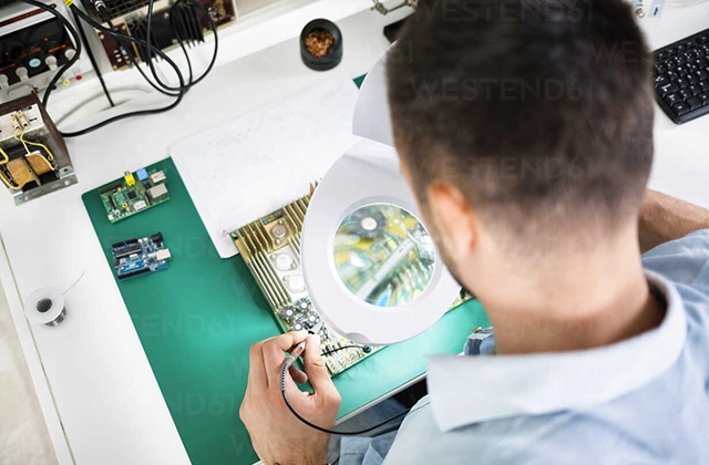 Magnifying Glass Circuit Board Checking